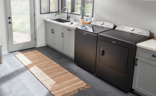 Grey washer and dryer in laundry room