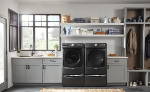 Laundry room featuring Maytag® washer and dryer