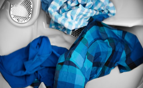 Clothes tumbling in a dryer.