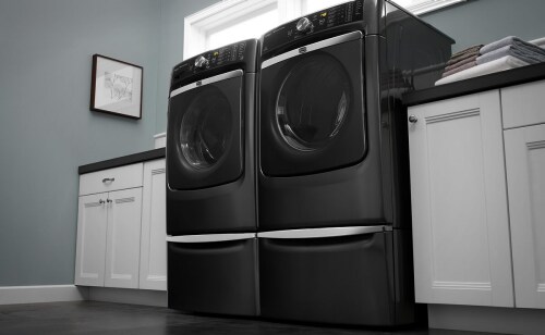 A Maytag® washer and dryer pair in a laundry room