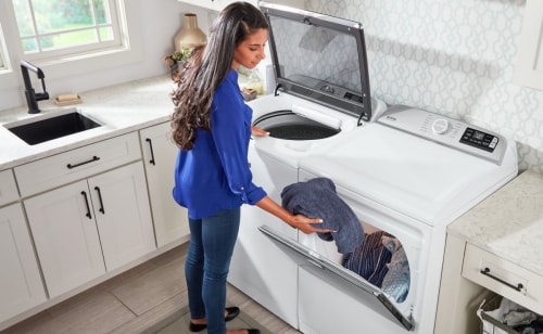 Moving clothes from washer to dryer