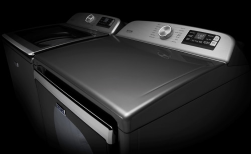 The consoles of a Maytag® top load washer and dryer