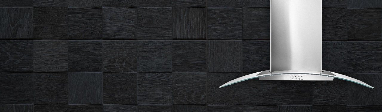 A stainless steel vent hood against a black background.