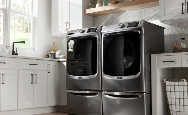 Laundry room with Maytag top load washer and dryer