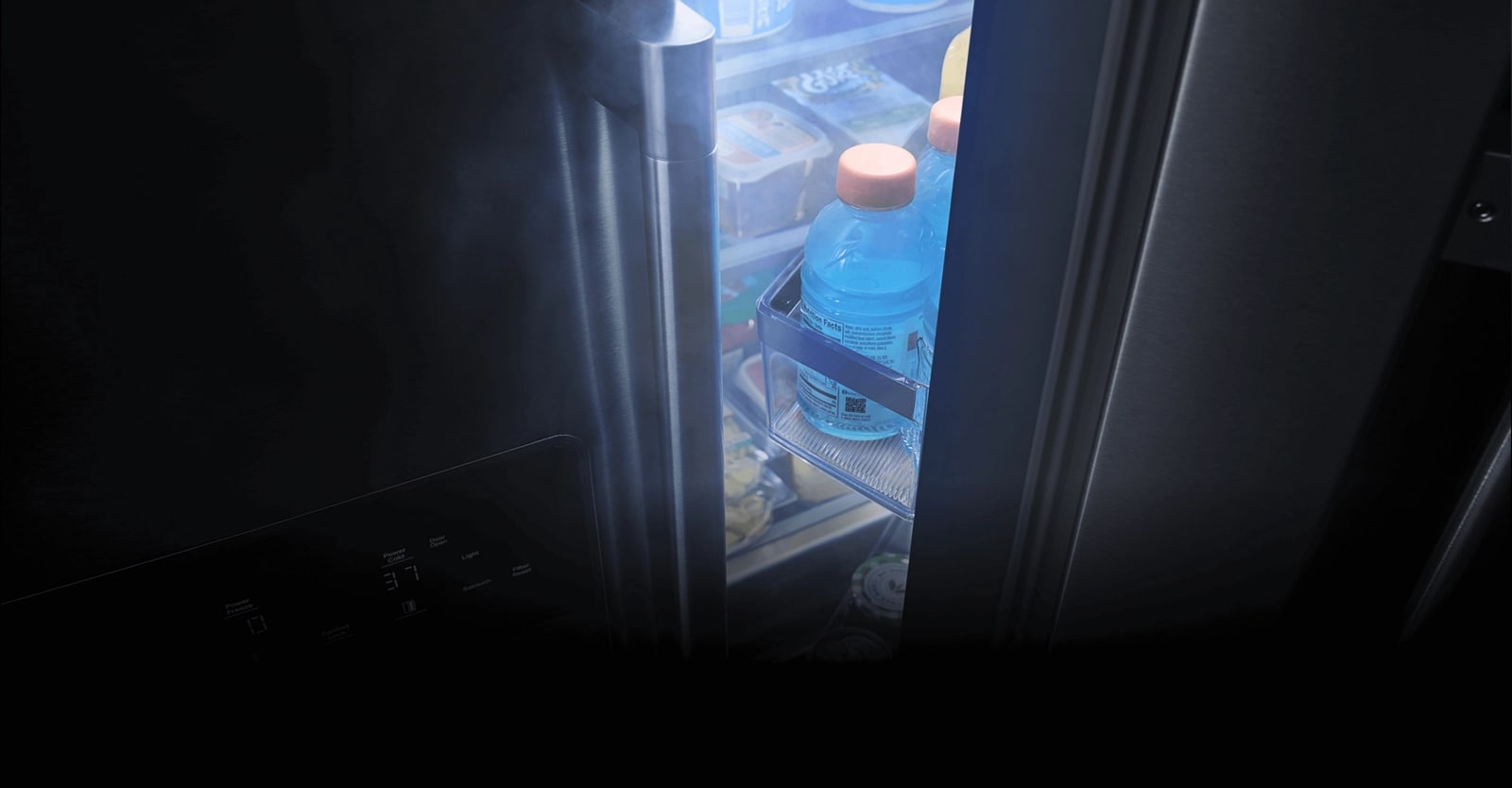 A stainless steel Maytag® refrigerator with its door ajar.