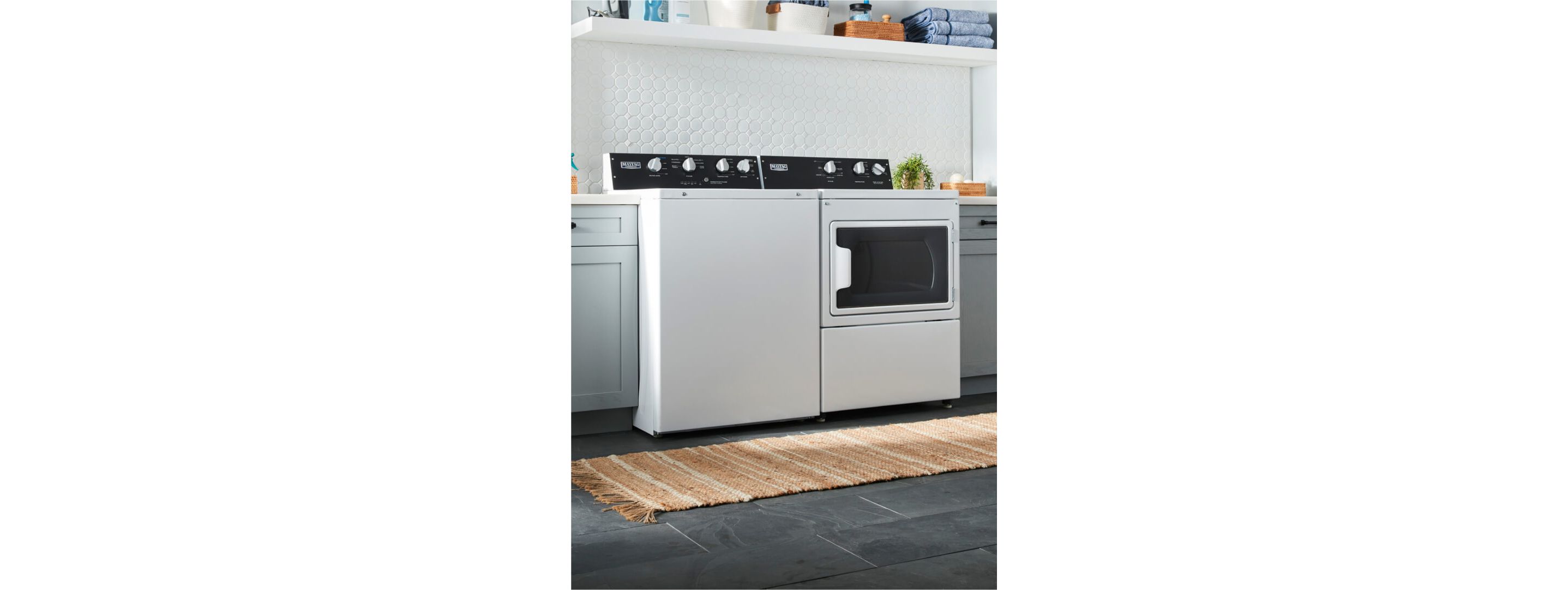 Commercial-grade washer and dryer in a home laundry room.