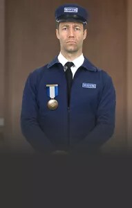 The Maytag Man wearing a medal.