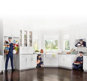 The Maytag Man inside a refrigerator, dishwasher, range and microwave cutout in a kitchen