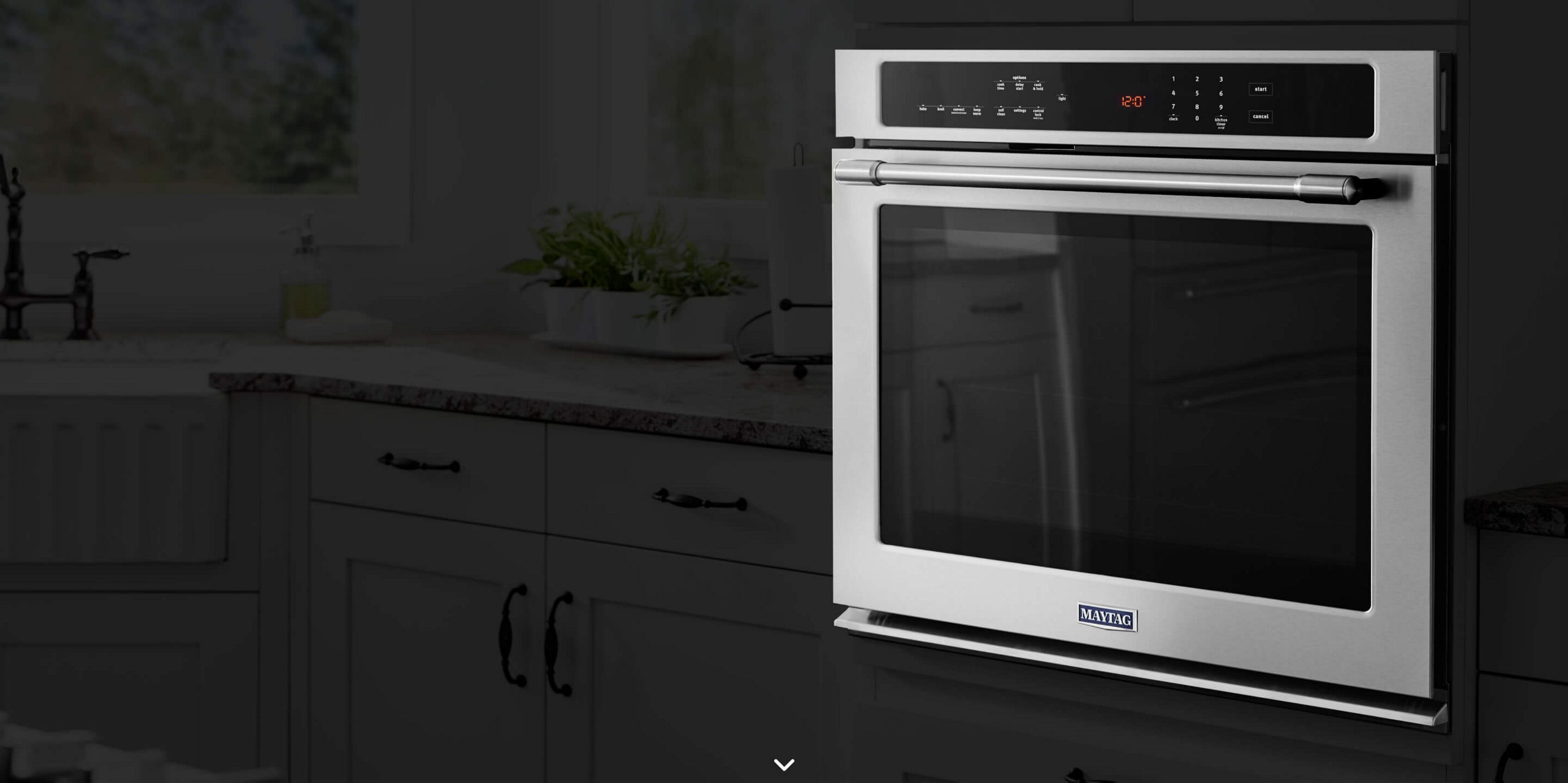 A Maytag® stainless steel wall oven in a kitchen.