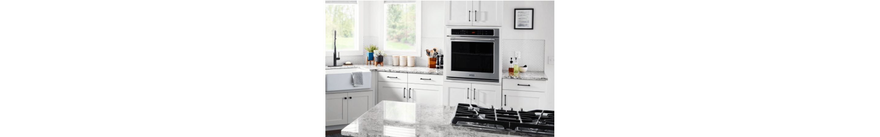 A Maytag® wall oven in a white kitchen