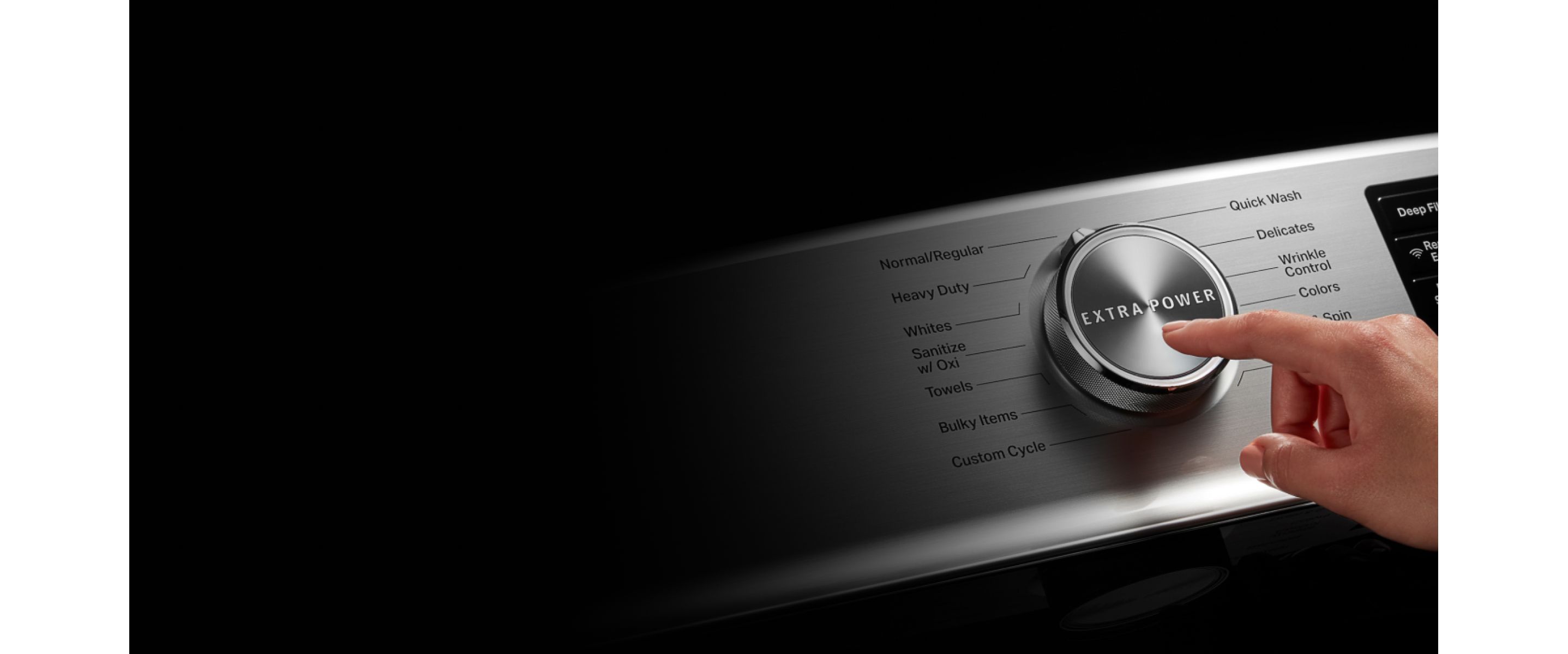 Person choosing a cycle on a Maytag® washing machine