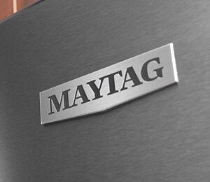 A closeup of the Maytag® badge