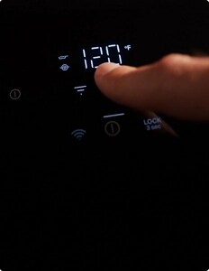 A person adjusting the controls