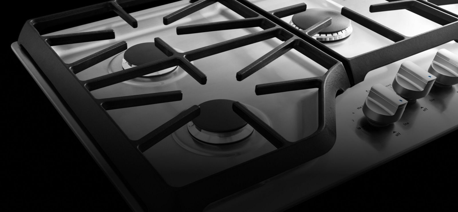 A Maytag gas cooktop surface.
