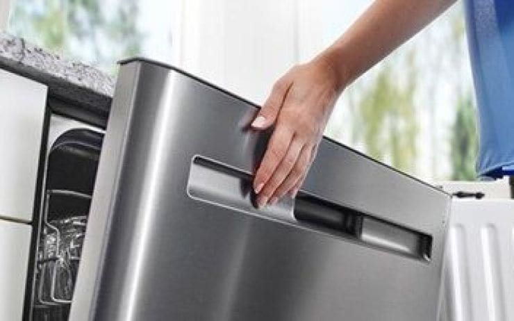 Hand closing stainless steel dishwasher.