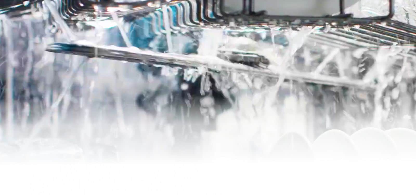 Water spraying out of the spray arm.