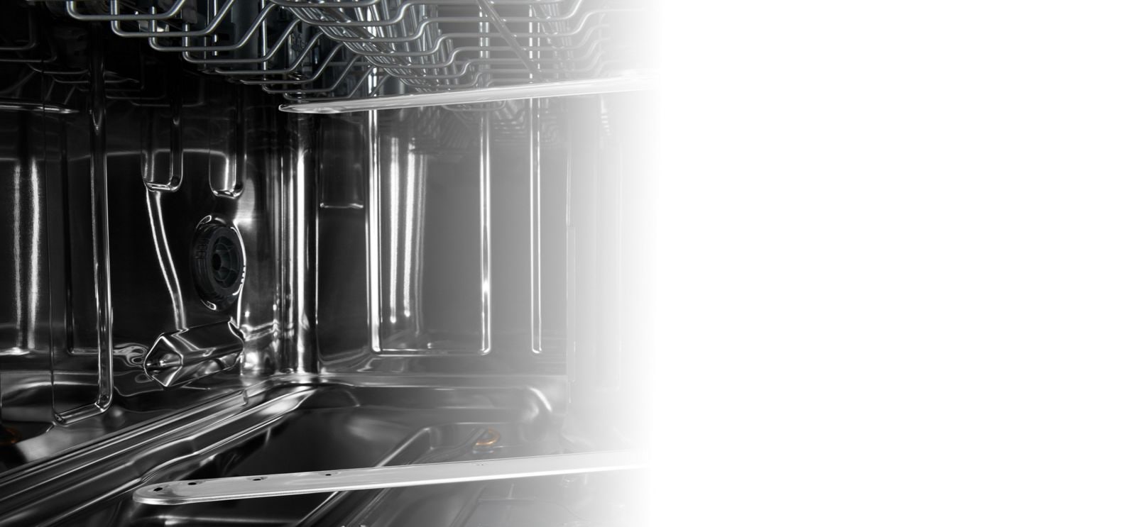 Shiny, stainless steel dishwasher interior.