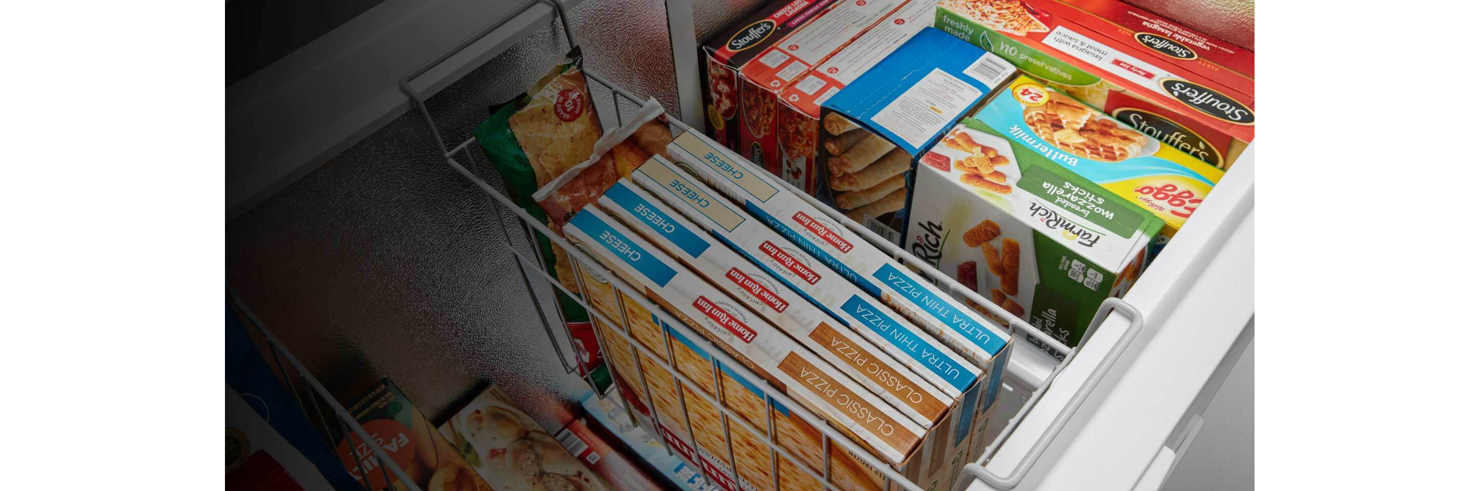 Frozen food inside a Maytag® chest freezer.