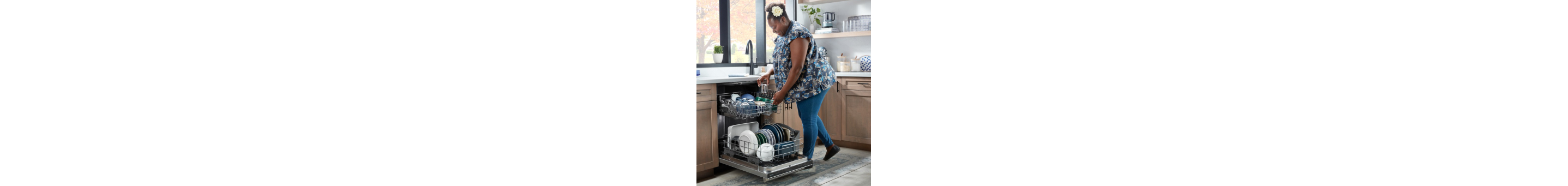 Person loading dishes in a dishwasher