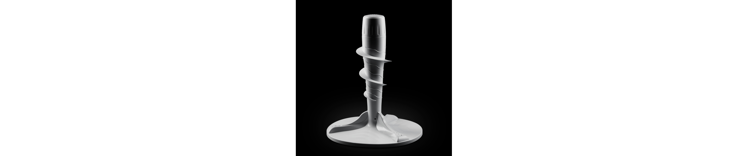 Top load washer agitator against black background