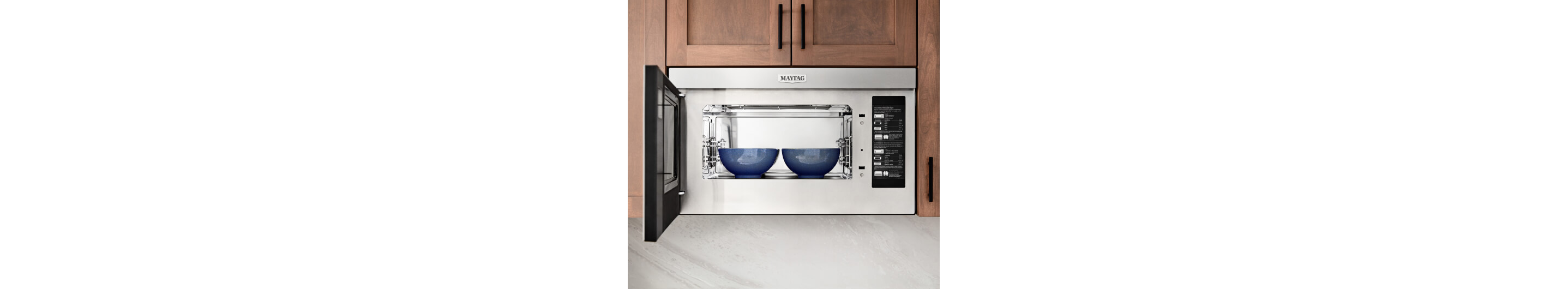 Two bowls inside a microwave.