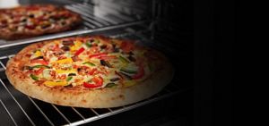 Baked pizza inside a microwave oven.