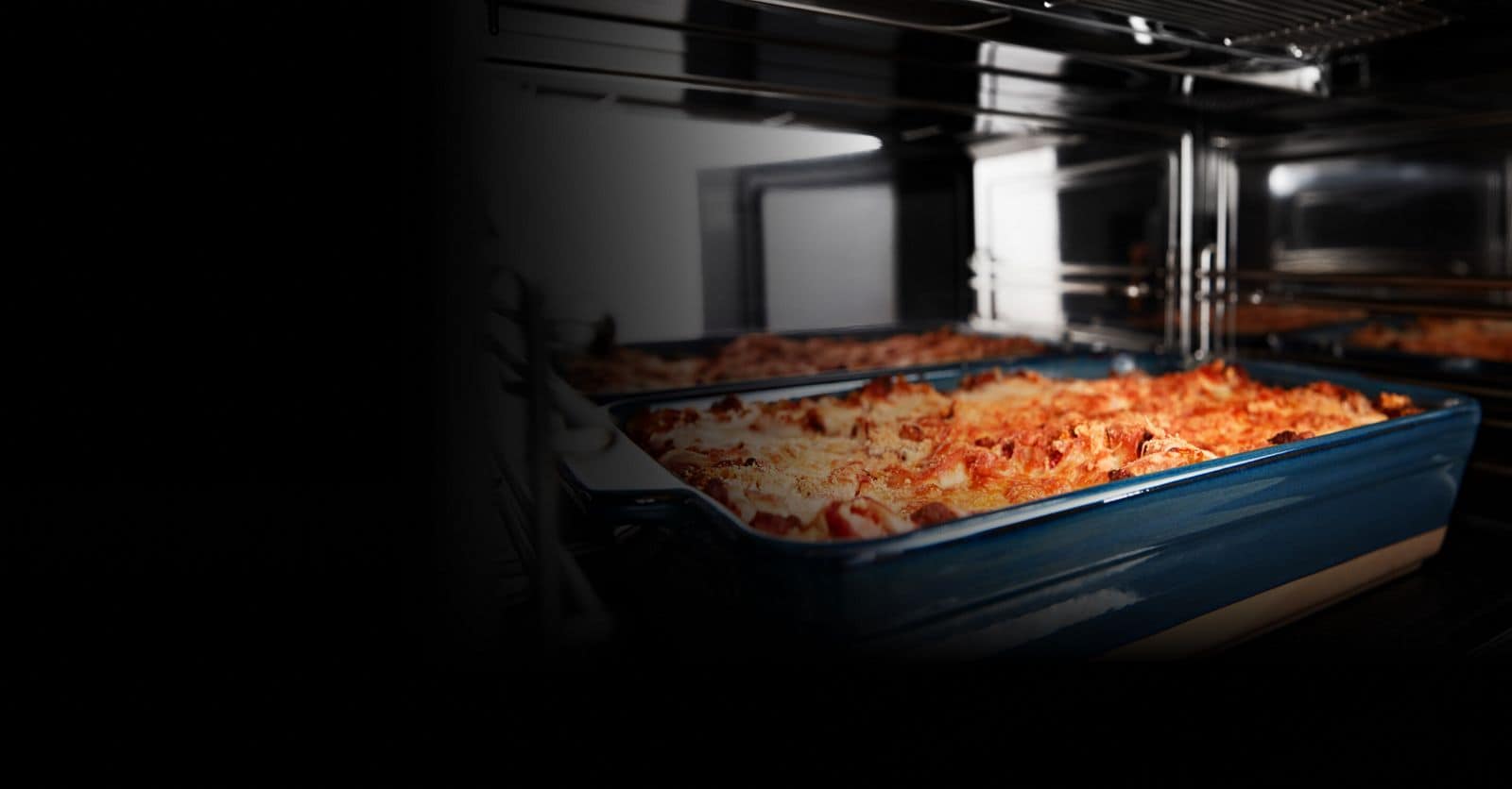 A microwave interior with a baking dish inside.