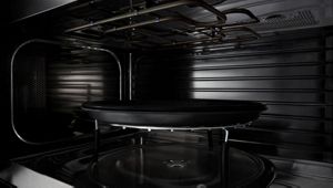 A close up of the crisping feature inside an open microwave