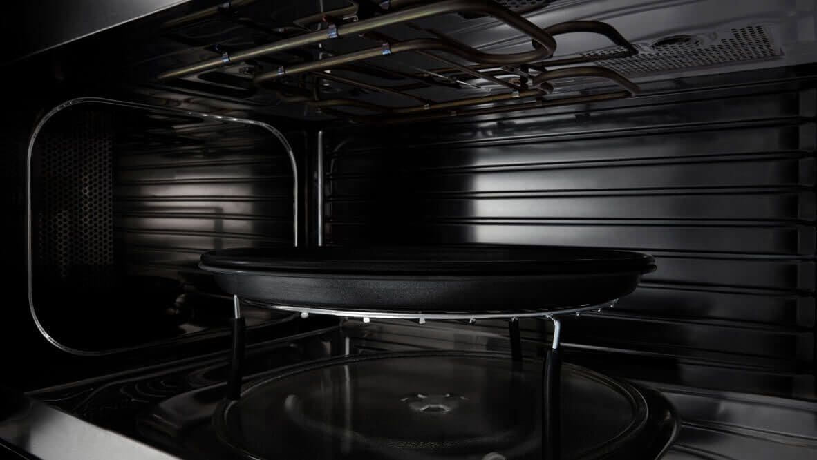 A close up of the crisping feature inside an open microwave