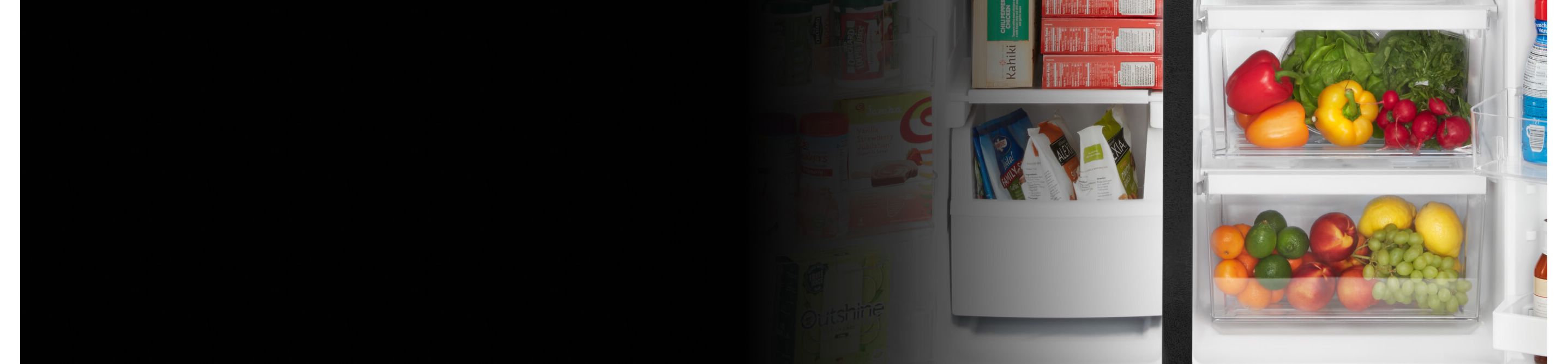 Close-up of produce and frozen food in side-by-side refrigerator
