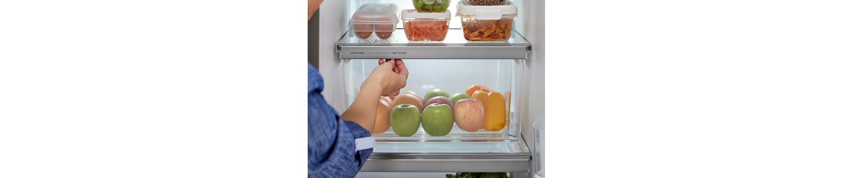 Person closing a refrigerator drawer