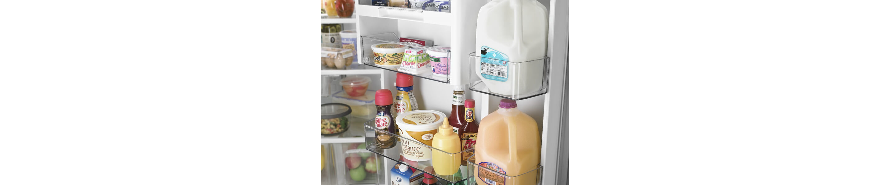 Dairy products and juice inside a refrigerator