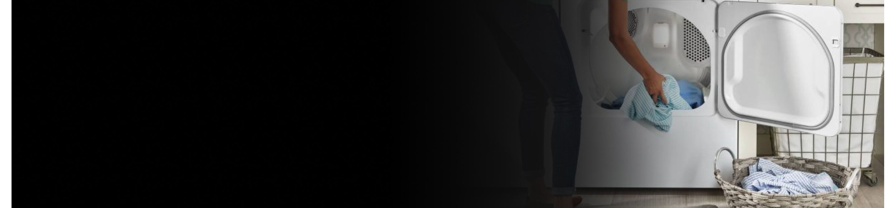 Woman loading blue shirt into a Maytag® dryer