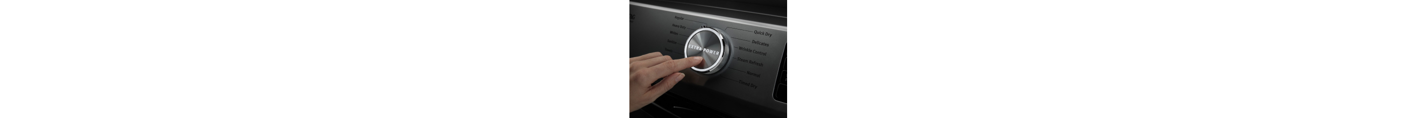 Person selecting a setting on a dryer control panel