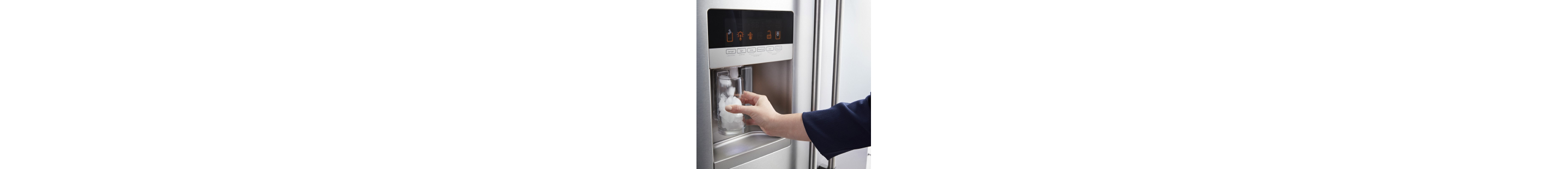 Person filling a glass of water from a refrigerator