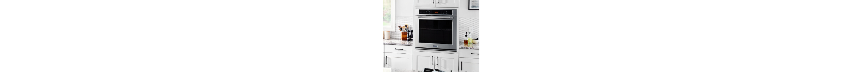 Single wall oven in a white kitchen