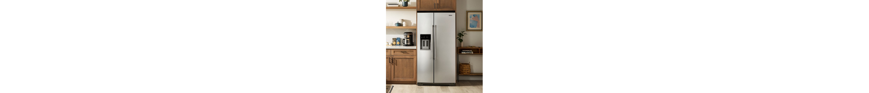 A refrigerator in a modern kitchen with brown cabinetry