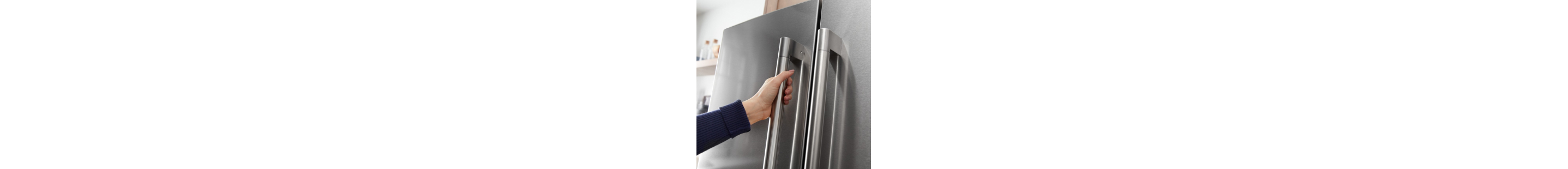 A person opening a refrigerator door