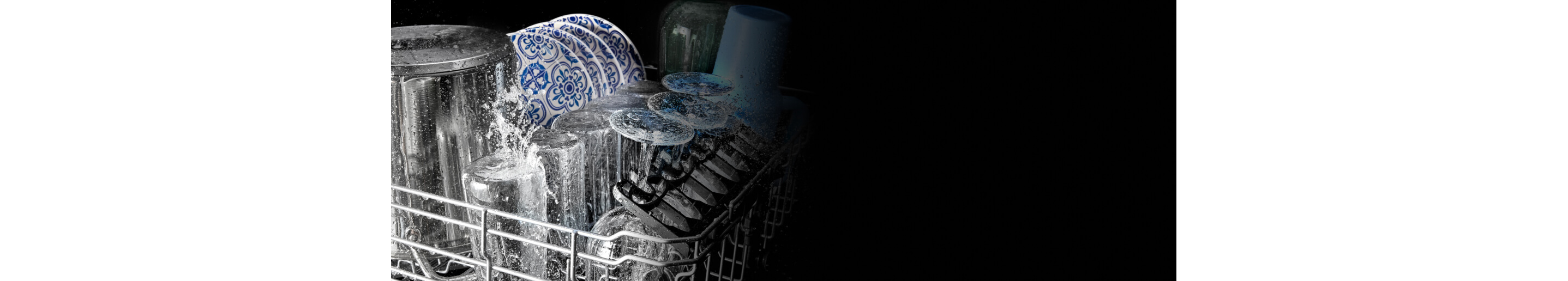 Glasses and plates being washed in a Maytag® dishwasher 
