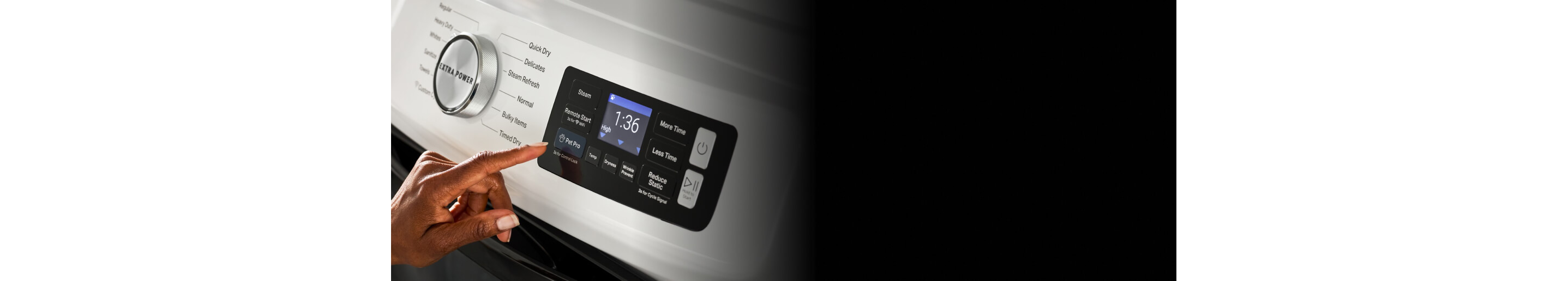 Person selecting a dryer setting on a Maytag® dryer control panel