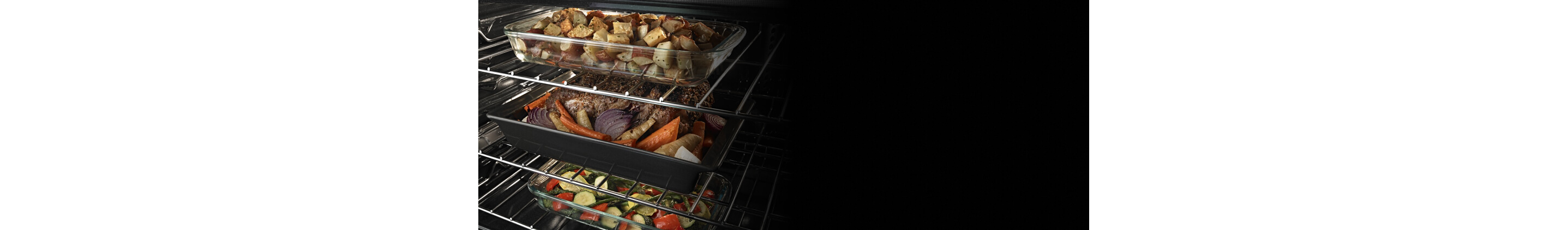 Three casserole dishes inside an oven