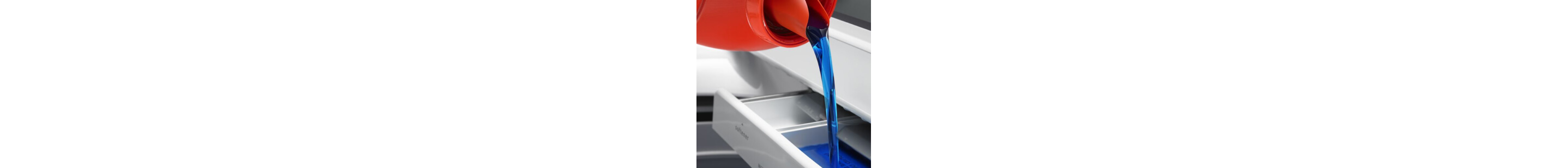 Laundry detergent being poured into a washing machine