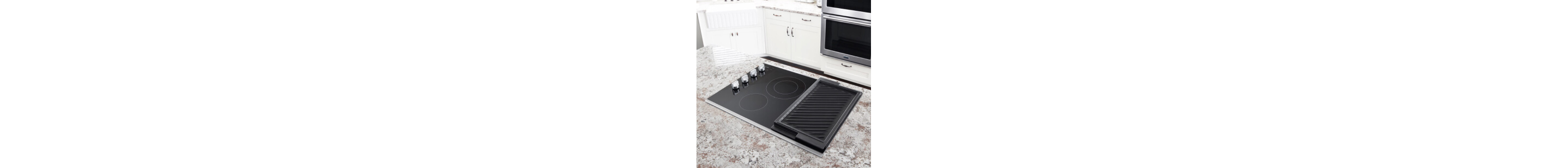 A cooktop on a kitchen island