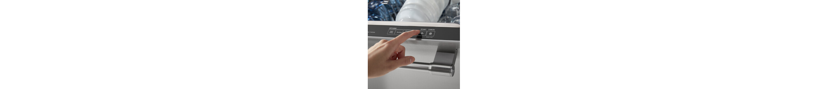 Person selecting a setting on a dishwasher control panel