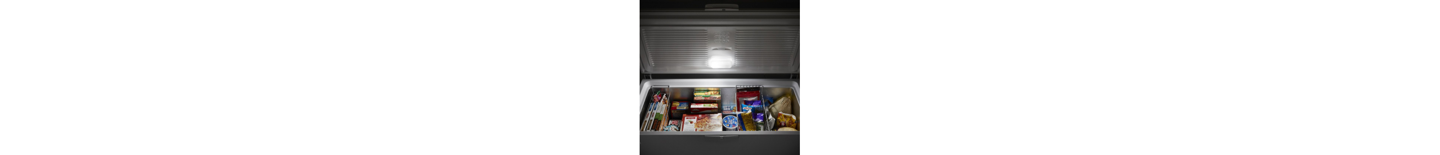 Open chest freezer filled with frozen food
