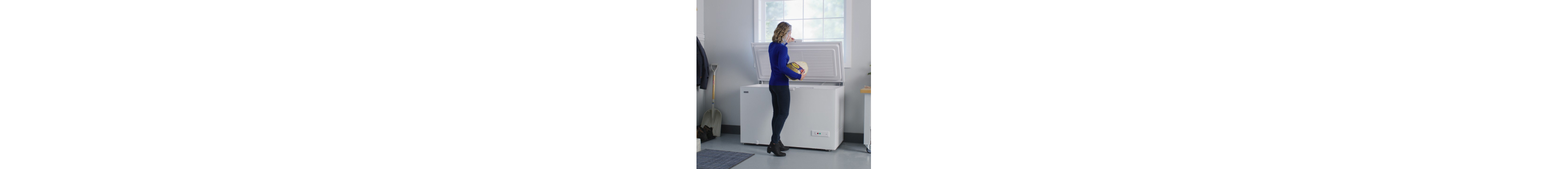 A person placing a turkey in a Maytag® chest freezer