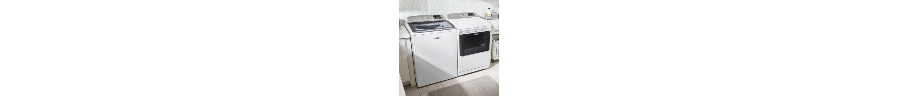 White Maytag®  washer and dryer pair in a laundry room