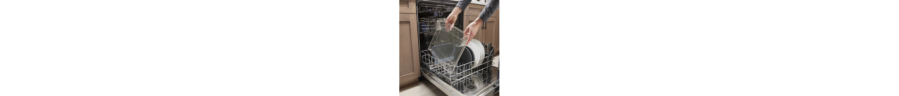 A person loading a dishwasher