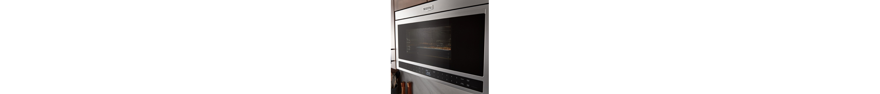 A closeup of a Maytag® microwave in a kitchen