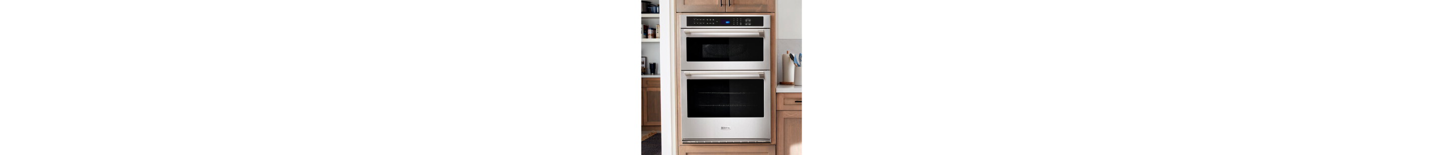 A Maytag® wall oven surrounded by brown cabinetry